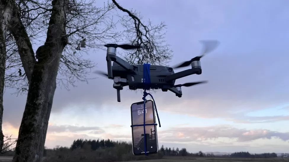 iphone hanging down from drone