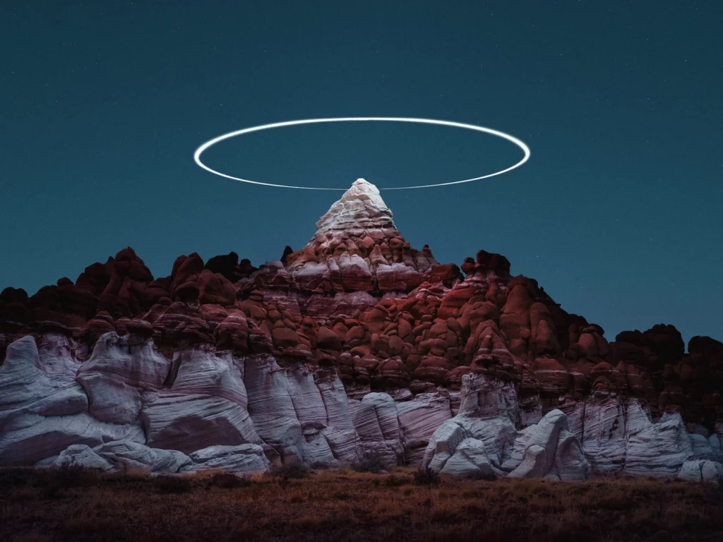 drone light painting halo around a mountain peak